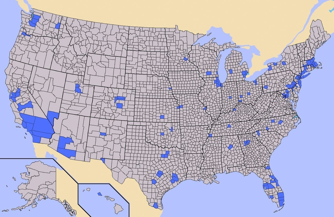 We see a county-level grey map of the United States, where only a very small number of counties are highlighted blue.